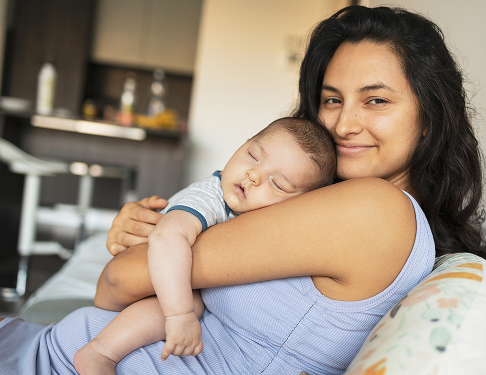 Page Header 2 Woman holding sleeping baby