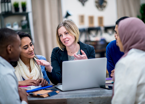 People meeting around a laptop
